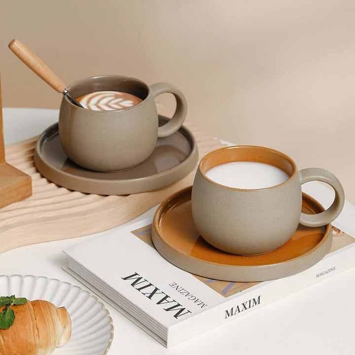 ZenCrafter coffee mug set with saucers, inspired by Japanese stoneware, featuring a coffee and milk latte on a wooden tray and magazine.